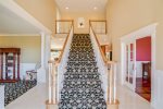 A gorgeous staircase leads to the level with 4 bedrooms