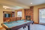The entertainment area offers a 5-star view to accompany a game of pool. 