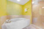 Enjoy a relaxing bath or a refreshing shower in the master bathroom