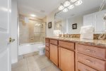 3rd bathroom with large vanity and shower/tub combo