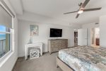 Master bedroom with dresser and desk