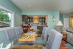 Dining area sits size people with two additional at the kitchen cabinet