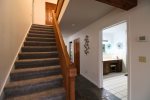 Stairs leading to primary bedroom.