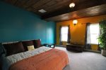 Downstairs Bedroom with a king-size bed