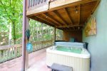 Hot tub with lovely wooded views.