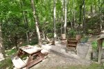 Firepit area with lovely wooded views. 