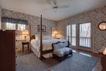 Master bedroom with king-sized bed on main level