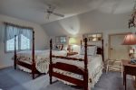 Bedroom 3 on upper level with queen-sized bed and 1 twin bed