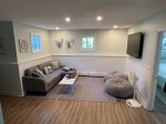 Basement living area with large screen TV