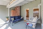 beautifully furnished screened in porch