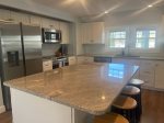 Counter area with stools in kitchen
