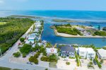 Aerial views of the home with boat ramp located at neighboring property