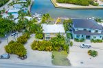 Aerial views of the home with boat ramp located at neighboring property