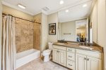 Ensuite bathroom with a tub, second floor queen bedroom