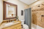Ensuite bathroom with a tub, second floor queen bedroom