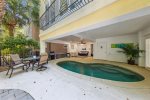 Grill, lounge, and relax by the pool