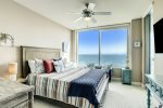 Secondary bedroom has queen size bed, gorgeous views of the Gulf and flat screen television. 