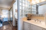 master suite vanity, glass block, pocket door