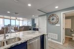 Half bath and laundry room located to the right of the clock