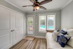 Off the primary room is a daybed/trundle and ceiling fan