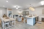 Coastal farmhouse design with tall ceilings for an open feel to the space