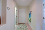 Hallway to front entrance and laundry room 