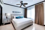 Second master bedroom with king bed and private bath.