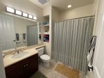 Guest bathroom with tub and shower