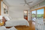 Second guest bedroom with Queen bed.  Sliding doors to the lanai. 