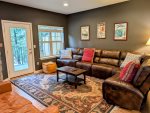 Oversize couch in the living room with views looking out into the Mt Hood National Forest