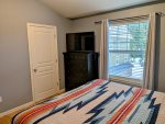 TV, private closet, and large dresser in the guest bedroom on the third floor