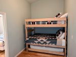 Full over Full bunk bed with twin-size pull out bed in the den area on the third floor