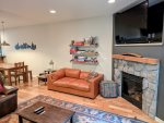 Gas fireplace and large flat screen TV in the living room area.