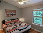 Queen-size bed in the master bedroom on the third floor