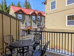 Private deck with a table and seating for four