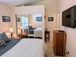 Master bedroom also includes a TV, closet, and attached private bathroom