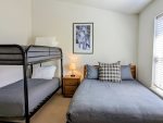 Full size bed and twin bunk bed in the Guest Bedroom on the third floor