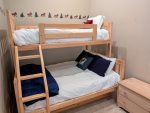 Twin size over full pyramid style bunk bed in the 3rd floor open den area