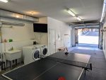 Private tandem 2-car garage with in-unit washer and dryer and ping pong table.