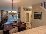 Looking out toward dining area from kitchen. Entry to half bathroom on 2nd floor. 