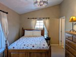 Master bedroom with a Queen size bed and attached private bathroom