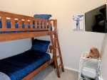 Twin over Twin bunk bed and TV in the semi private den no door or closet