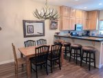 Dining table with seating for 6 plus 4 stools at the breakfast bar