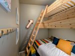 Custom built triple deck bunk bed with two twin beds and one full size bed