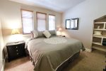 Master bedroom with comfy king bed and night stands with drawers