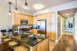 This fully appointed kitchen boasts stainless appliances & ample counter space for cooking