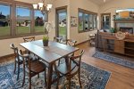 Dining area with seating for 6, plus 2 barstools for additional seating