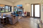 Gorgeous living area with tv, gas fireplace, and huge ceiling height