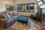 Gorgeous living area with gas fireplace and views of the water