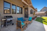 Private covered patio with furniture and Weber natural gas barbeque
